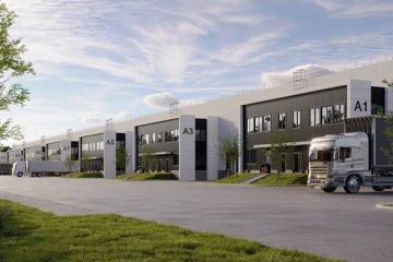 Современные склады формата light industrial в промпарке Соколово с доковыми зонами и грузовыми автомобилями на фоне делового дня